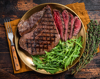 Grilled Steak Plated with Fresh Arugula Salad at Assisted Living Facility Grilled Steak Plated with Fresh Arugula Salad at Assisted Living Facility