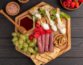 Charcuterie Board with Cheese Fruit and Crackers at Assisted Living Facility Charcuterie Board with Cheese Fruit and Crackers at Assisted Living Facility