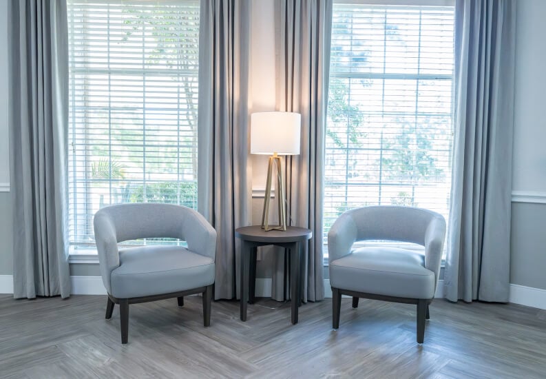 Sitting Nook with Gray Chairs and Natural Light at Assisted Living Facility Sitting Nook with Gray Chairs and Natural Light at Assisted Living Facility