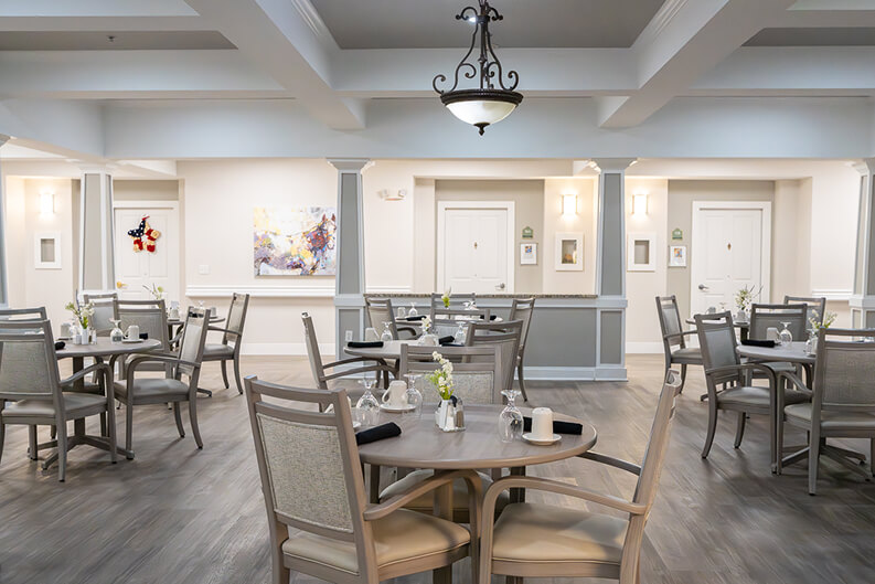Dining Room Table Setting with Large Windows at Assisted Living Facility Large Dining Hall Area for Seniors Living in Memory Care Facility