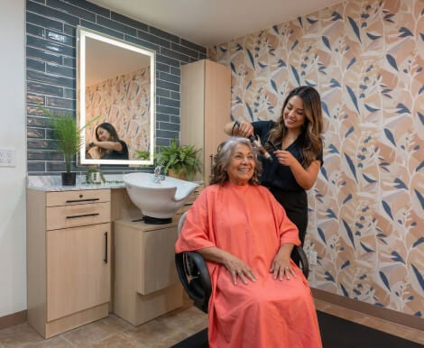 Senior Woman Getting Hair Done in Salon at Assisted Living Facility Senior Woman Getting Hair Done in Salon at Assisted Living Facility